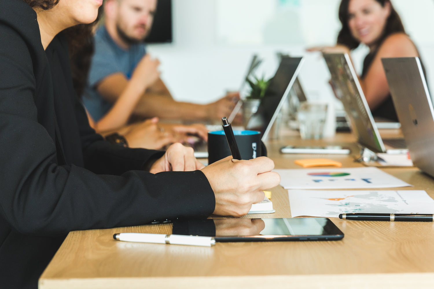 Group of young professionals discussing at a work setting